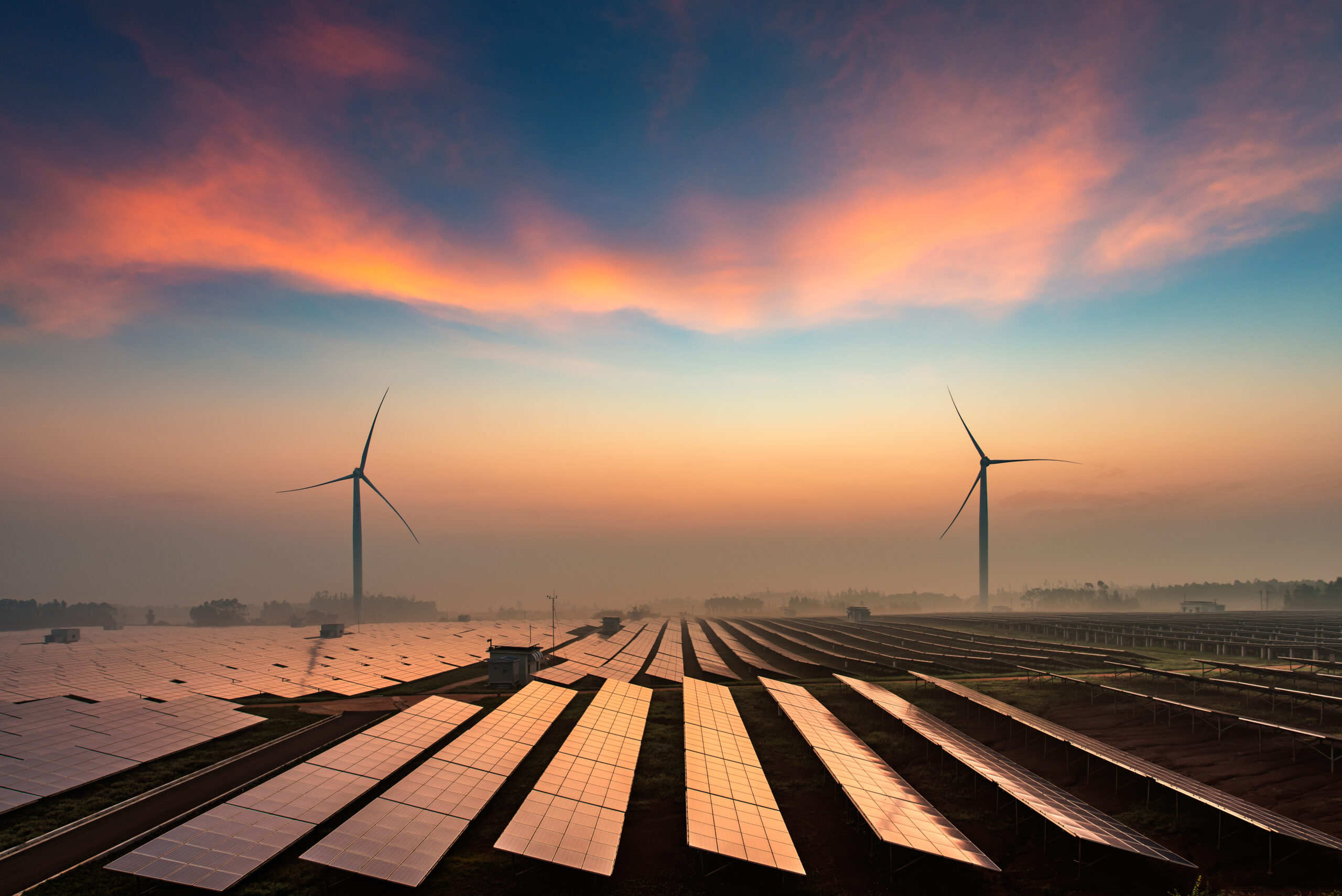 Solar farm with wind farms in the background ready to be optimised